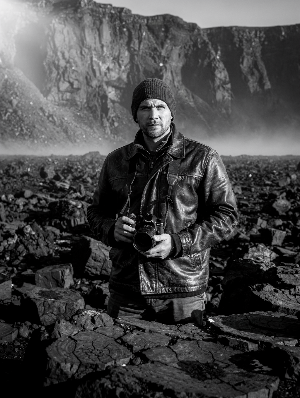 Photographer standing in remote Icelandic landscape